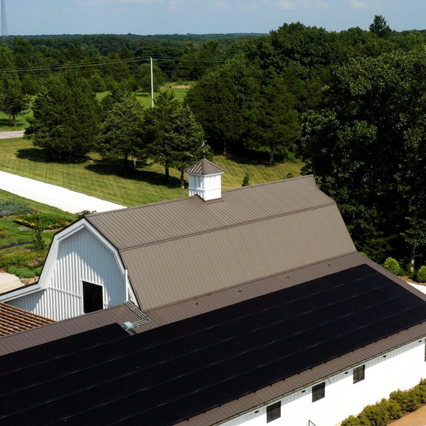 Aerial view of rooftop commercial solar installation for Missouri flower farm Long Row Lavender